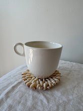 Load image into Gallery viewer, Cowrie Shell Trivet
